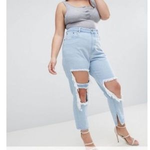 Plus size skinny jeans with extreme distressing